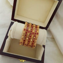 Gleaming Keyhole Gold Look Bangles