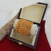 Gleaming Gold Polished Bangles Set