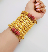 Adorn your wrists with our Golden Gleam Bangles